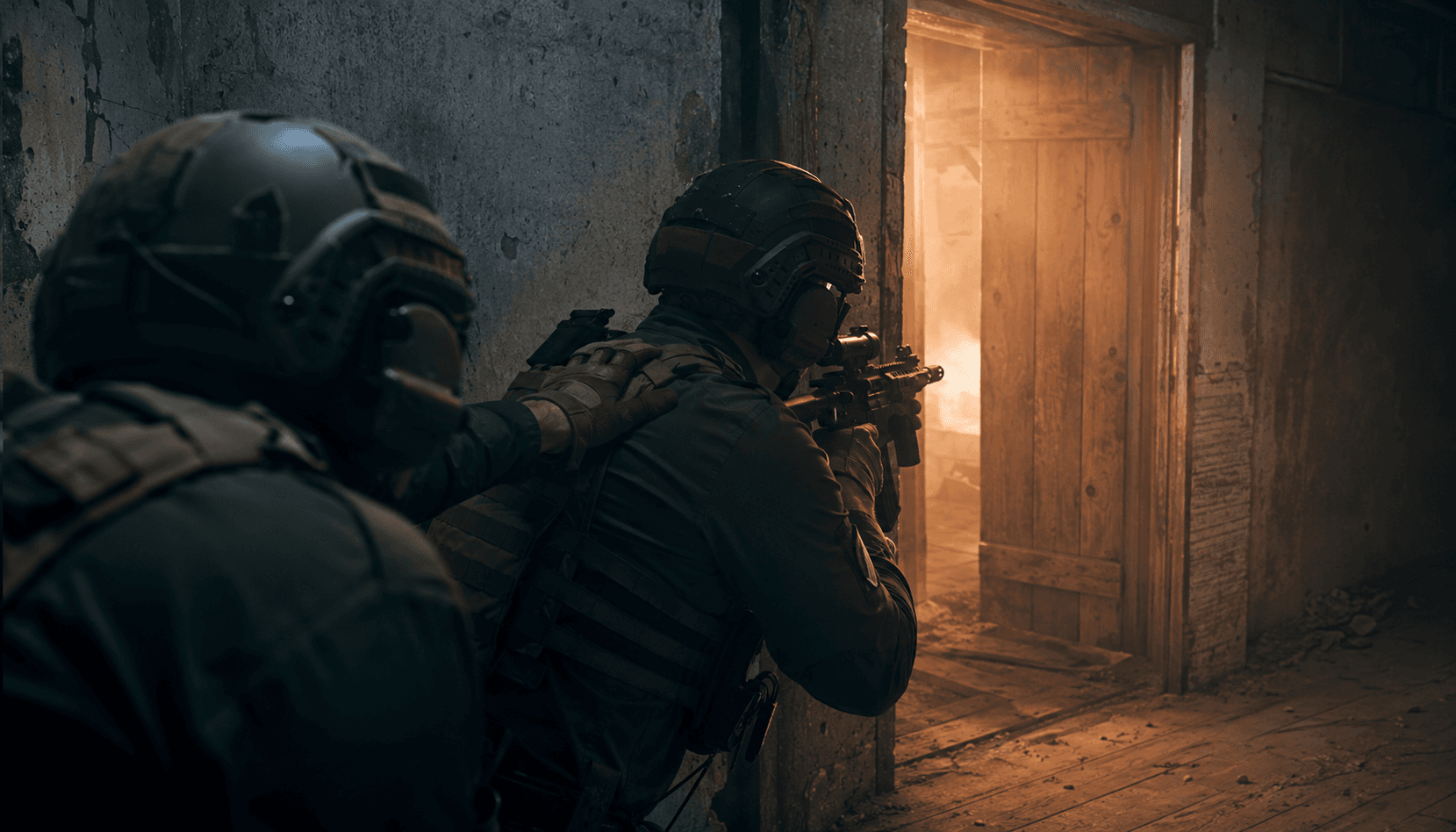 Low-angle cinematic shot of two tactical airsoft operators stacked outside a wooden doorway in a CQB shoot-house, warm amber light spilling through the gap, lead operator at the low ready